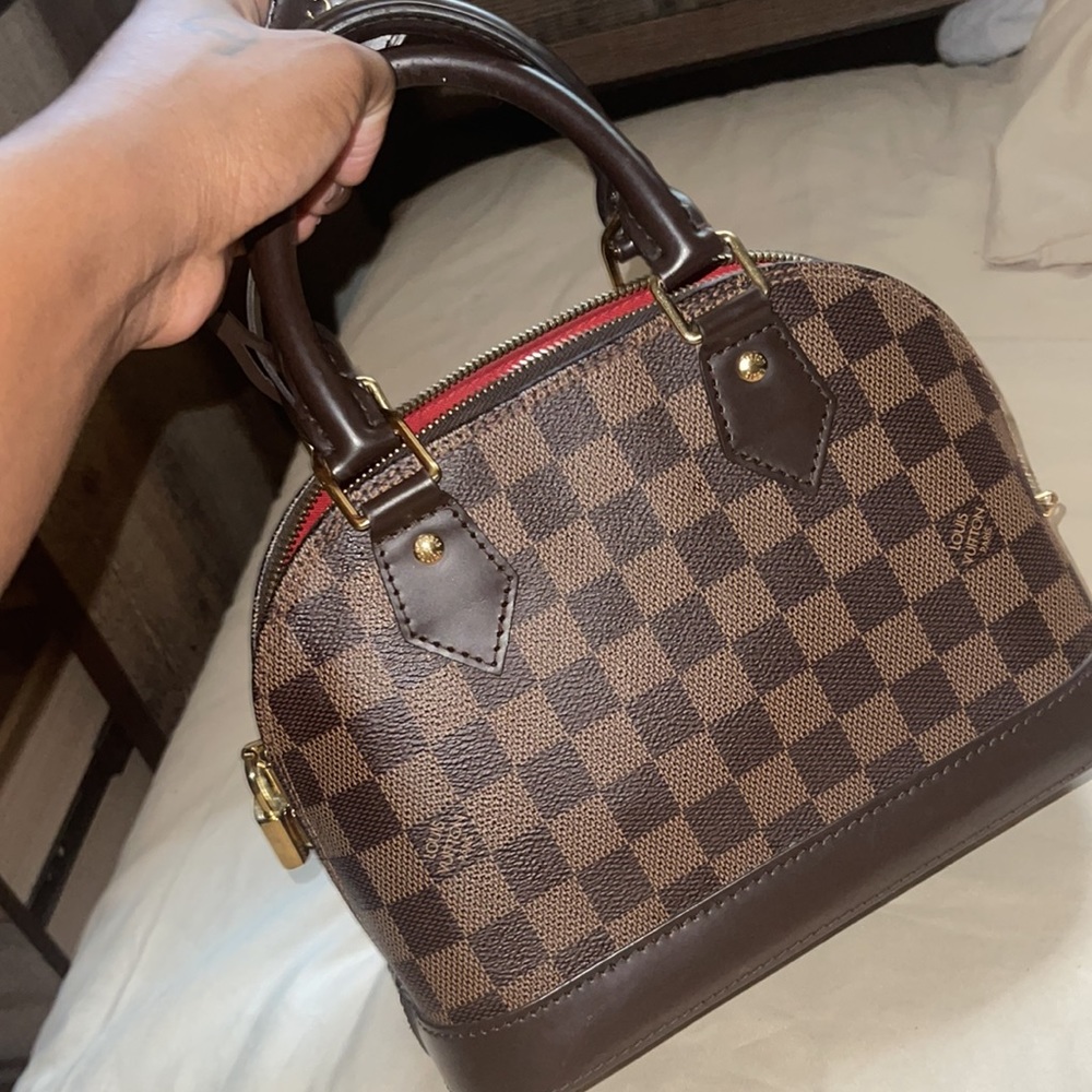Louis Vuitton. Damier Alma Handbag. Well taken care of. Gently used. No damages.